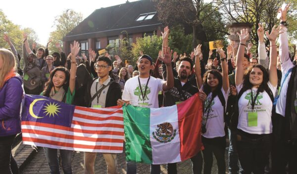 Representatives from the Malaysian Youth Delegation (holding the Malaysia flag) attended the 13th Conference of Youth (COY13) in Bonn, Germany together with youths from around the world. (November 2017) Photo: courtesy of MYD website